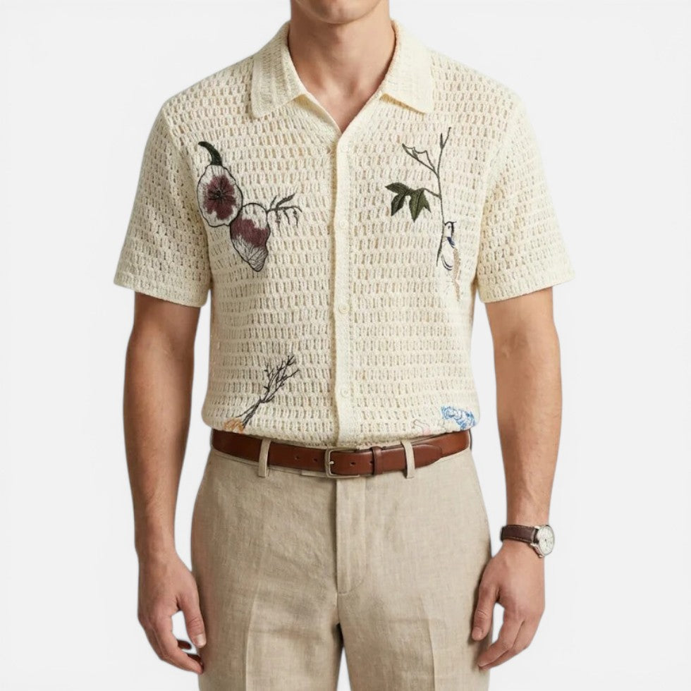 Man wearing a cream button-front crochet shirt, upper-body view