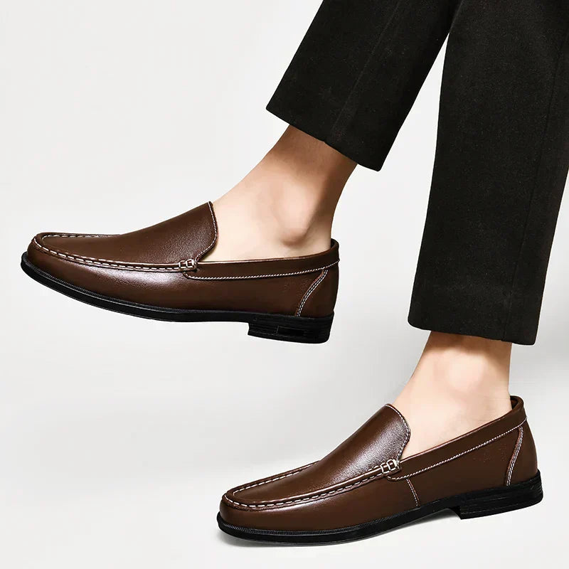 Brown plain-front slip-on dress loafers with moc-toe stitching