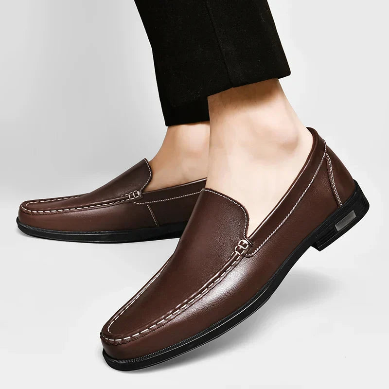 Brown plain-front slip-on dress loafers with moc-toe stitching