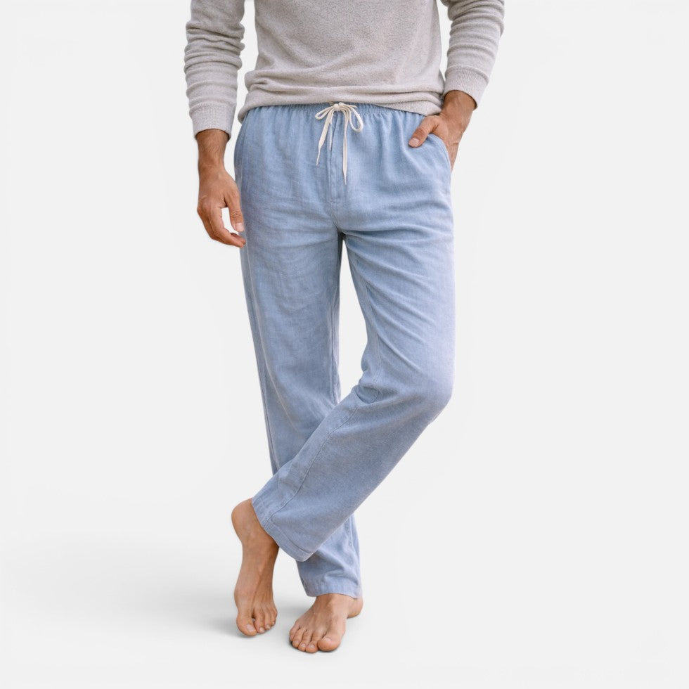 Man wearing light-blue straight-leg drawstring trousers