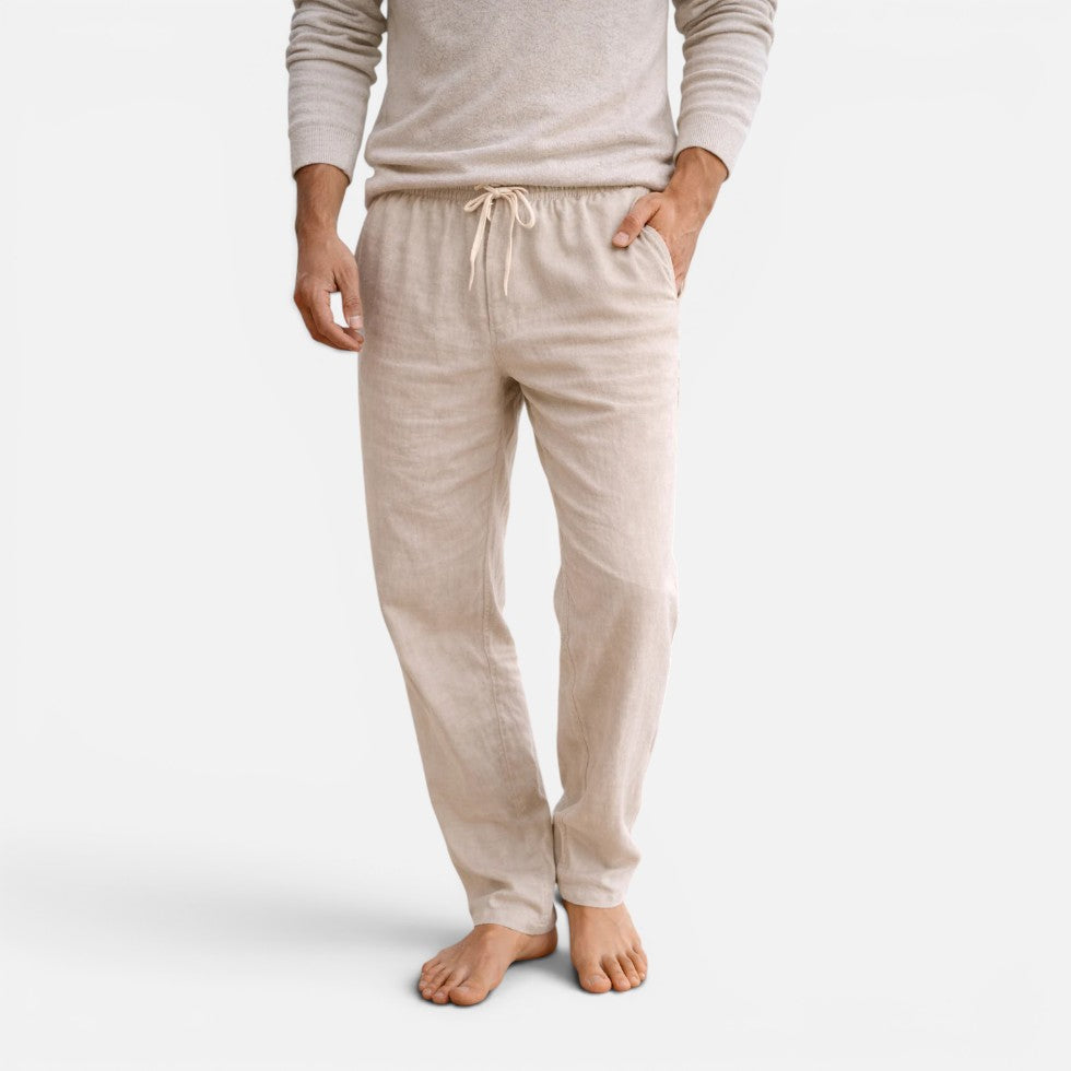 Man wearing beige straight-leg drawstring trousers