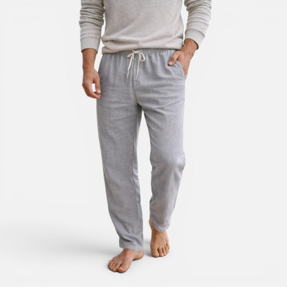 Man wearing light-grey straight-leg drawstring trousers