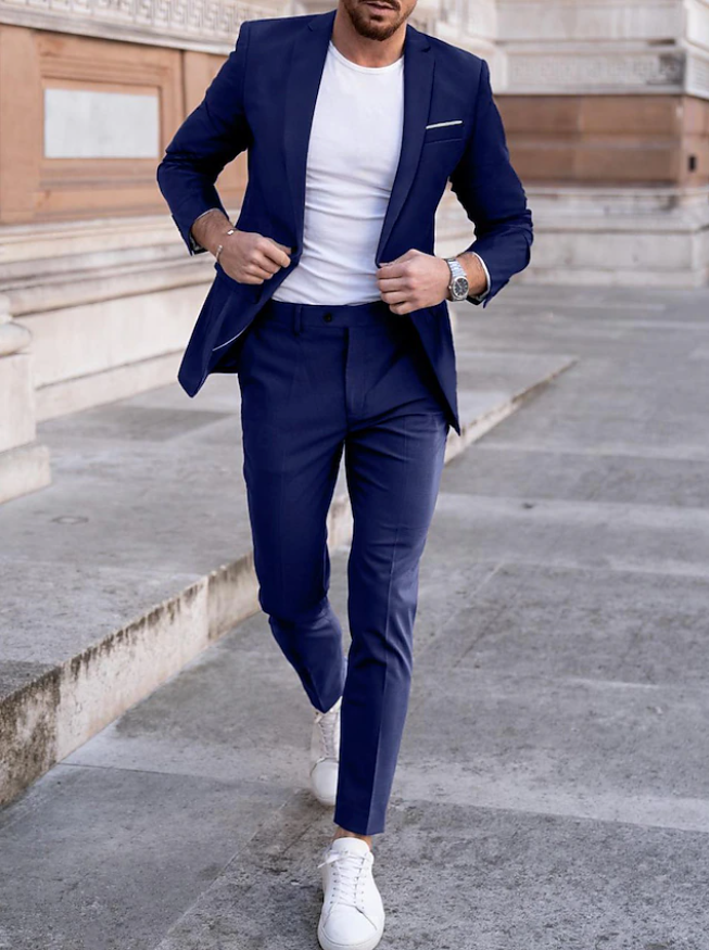 Man wearing a navy suit with a white T-shirt