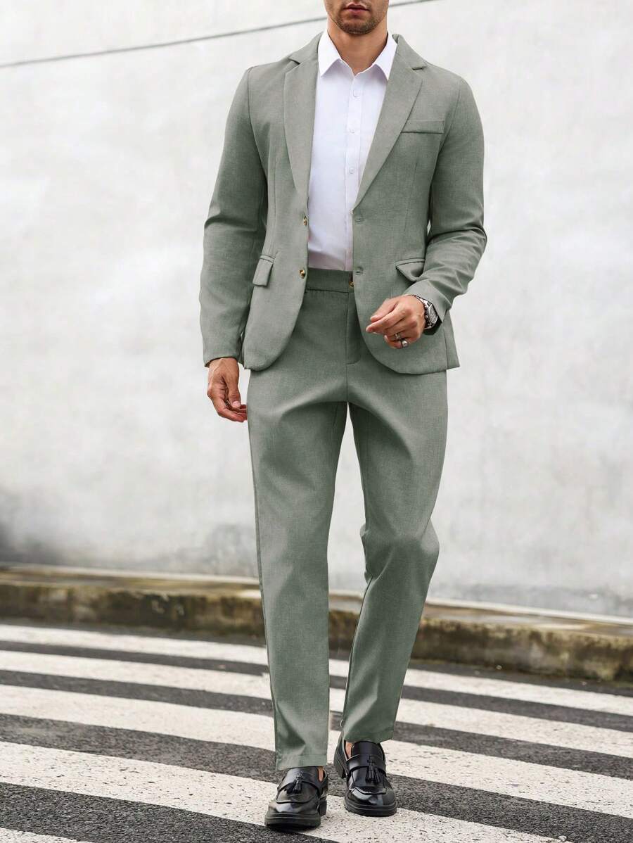 Man wearing an olive-green suit with a white shirt, front view