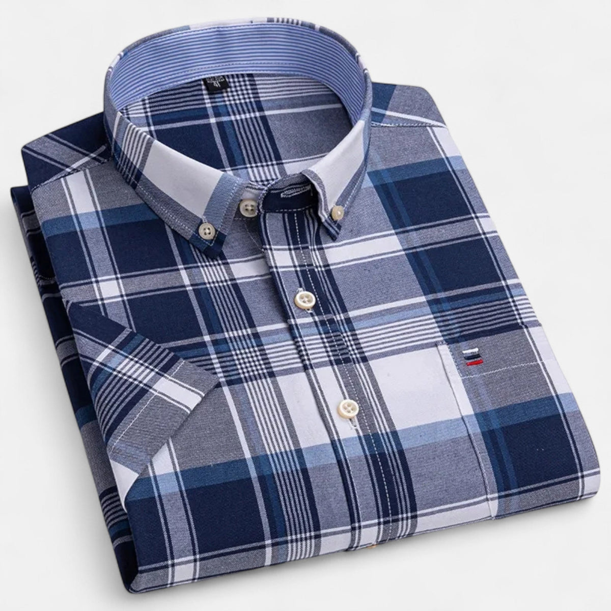 Folded navy, gray and white plaid short-sleeve button-down shirt
