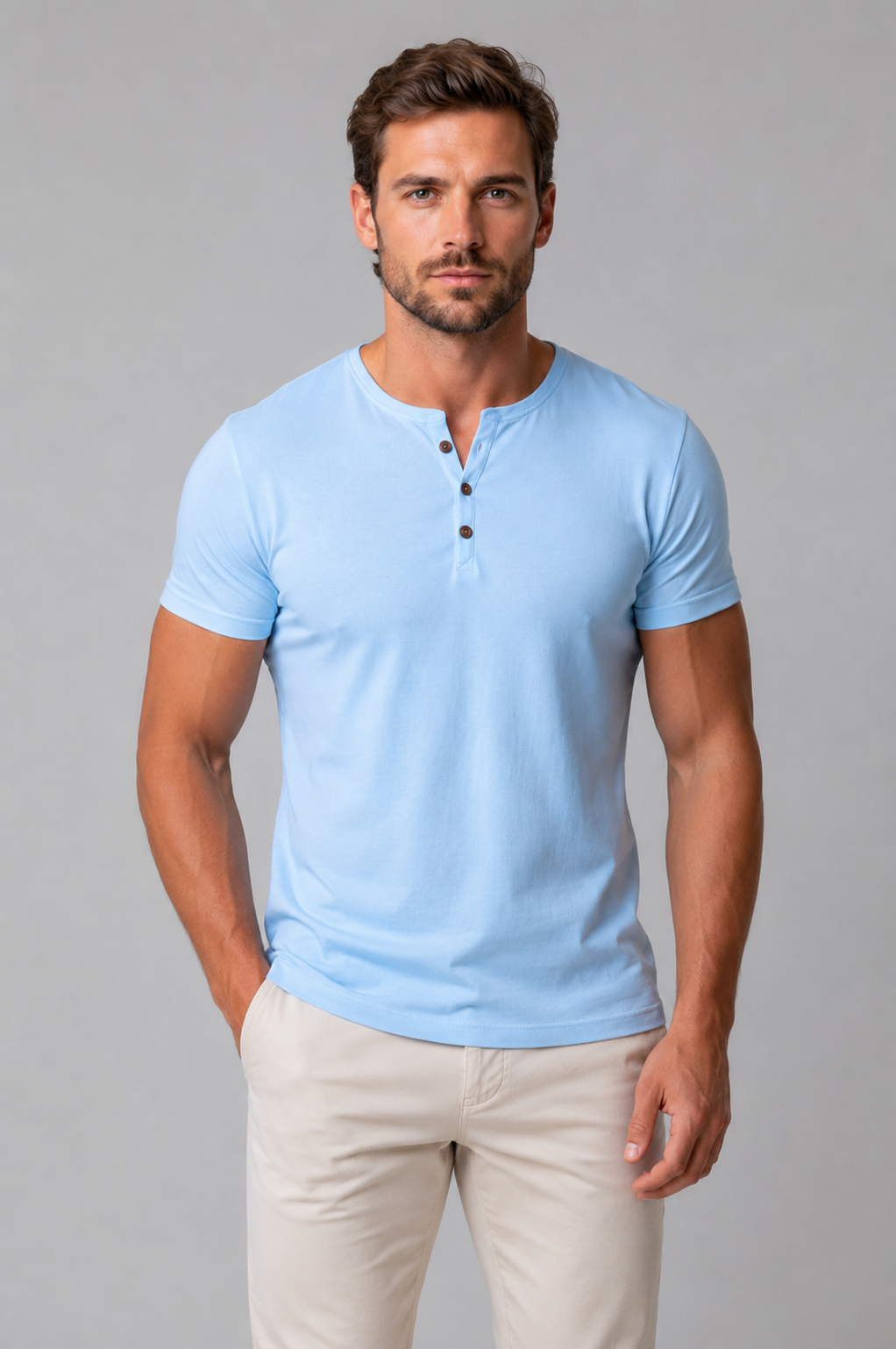 Man wearing a light blue short-sleeve Henley T-shirt, front view