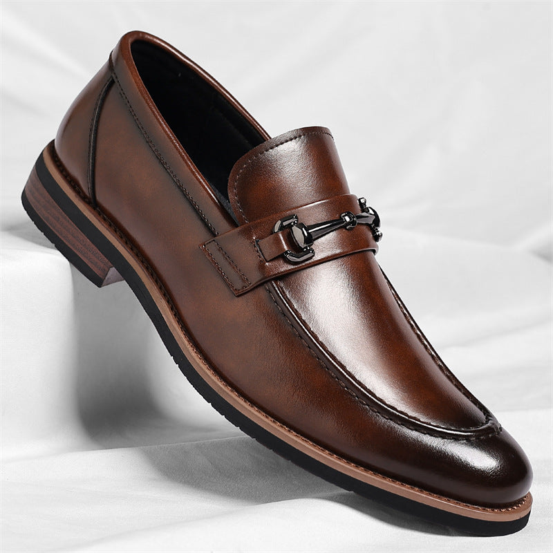 Brown slip-on dress loafer with a metal bit across the front