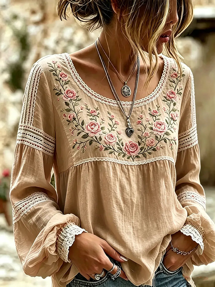 Khaki blouse with rose embroidery, a rounded neckline and lace-trimmed sleeves