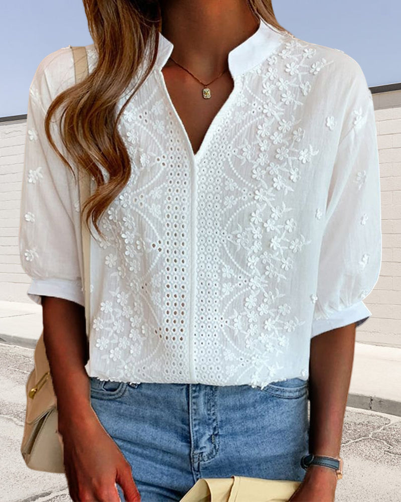 Elegant puff sleeve blouse with V-neck design, featuring a stylish and feminine fit.