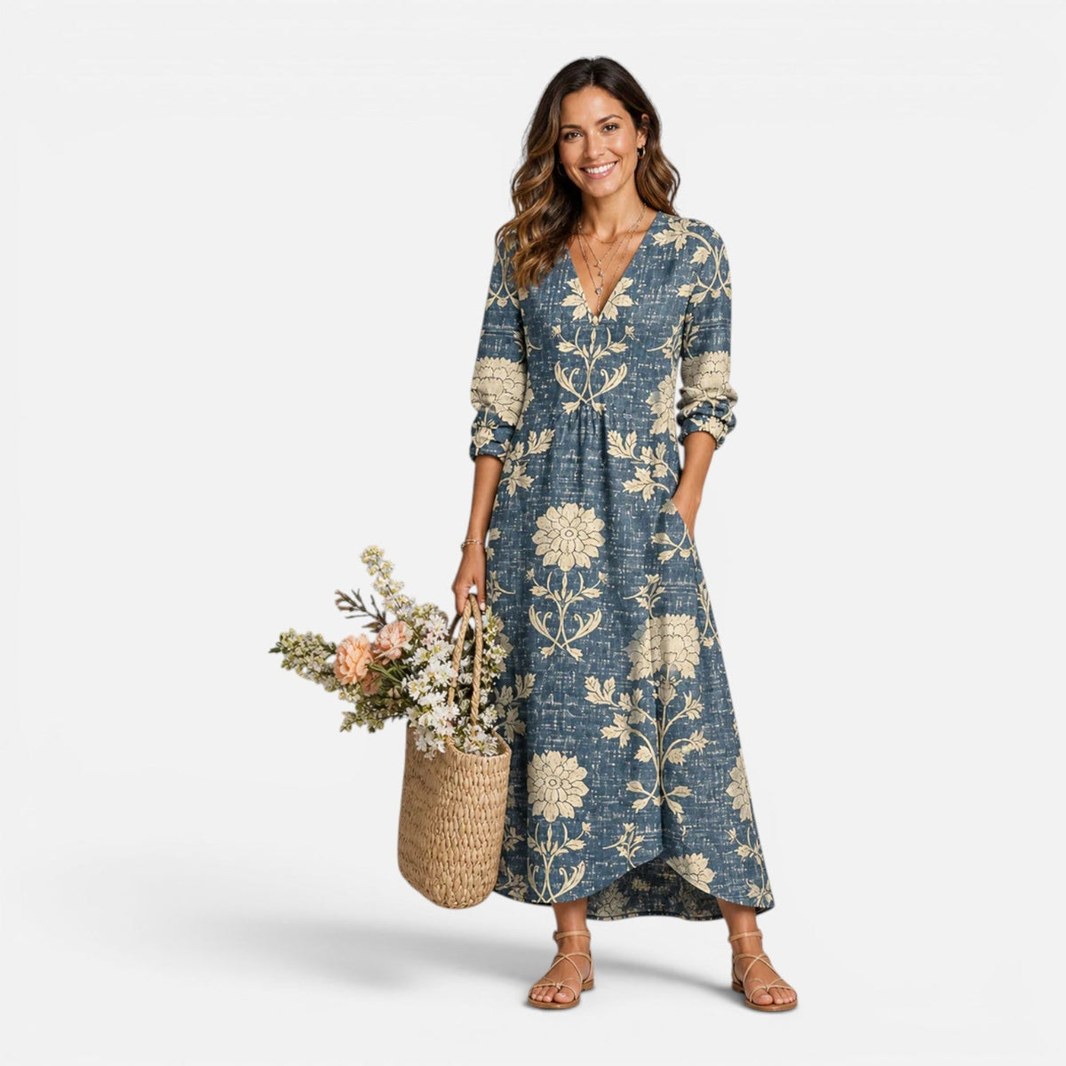 Blue floral V-neck dress with three-quarter sleeves and a relaxed skirt