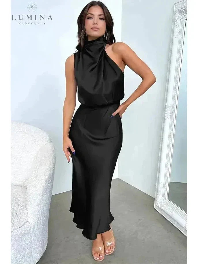 Black Ashley cocktail dress, elegant evening dress for wedding guests, shown in size S with stylish details.