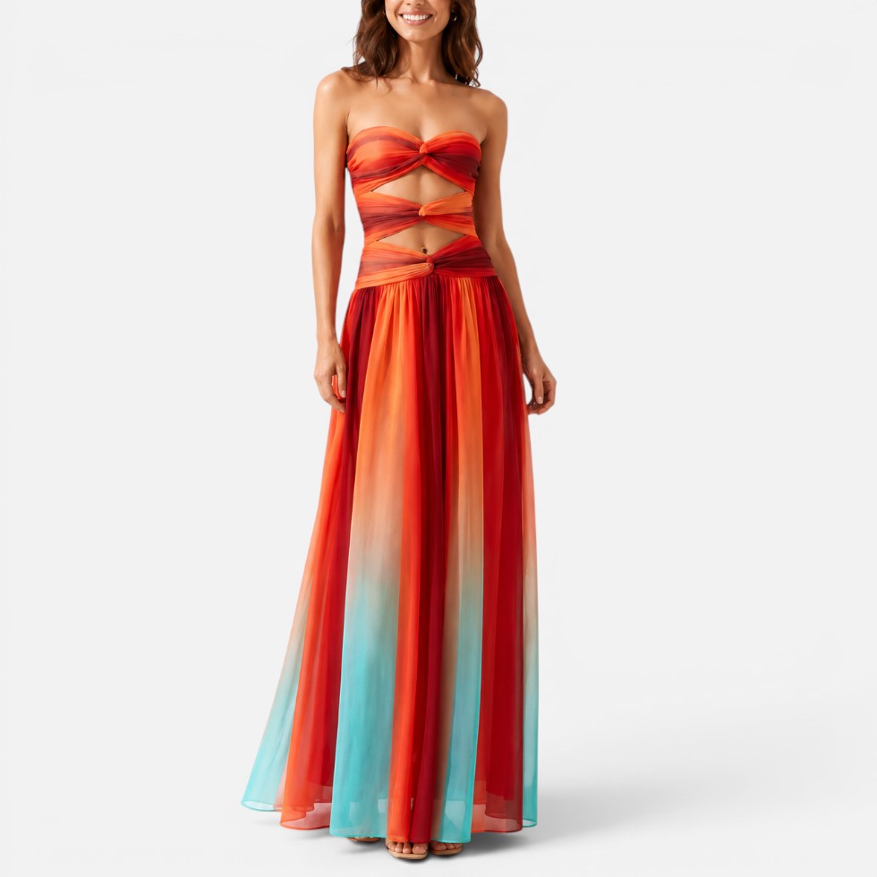 Woman wearing a strapless red-and-orange ombré maxi dress with waist cut-outs, front view