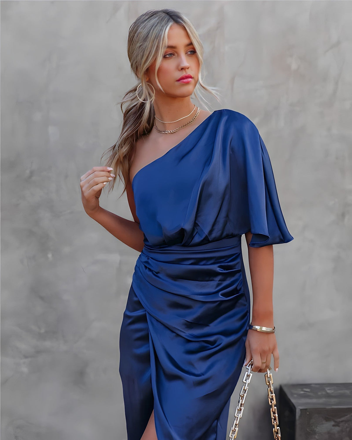 Women's one-shoulder dress with a draped sleeve