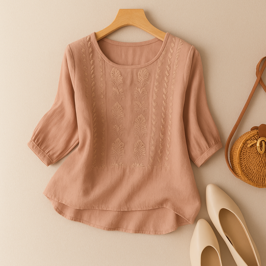 Blush blouse image with floral motifs on the front panels