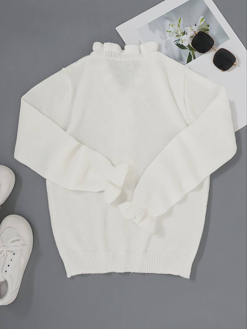 Victoria blouse featuring elegant ruffle design and decorative buttons, perfect for stylish women's fashion.