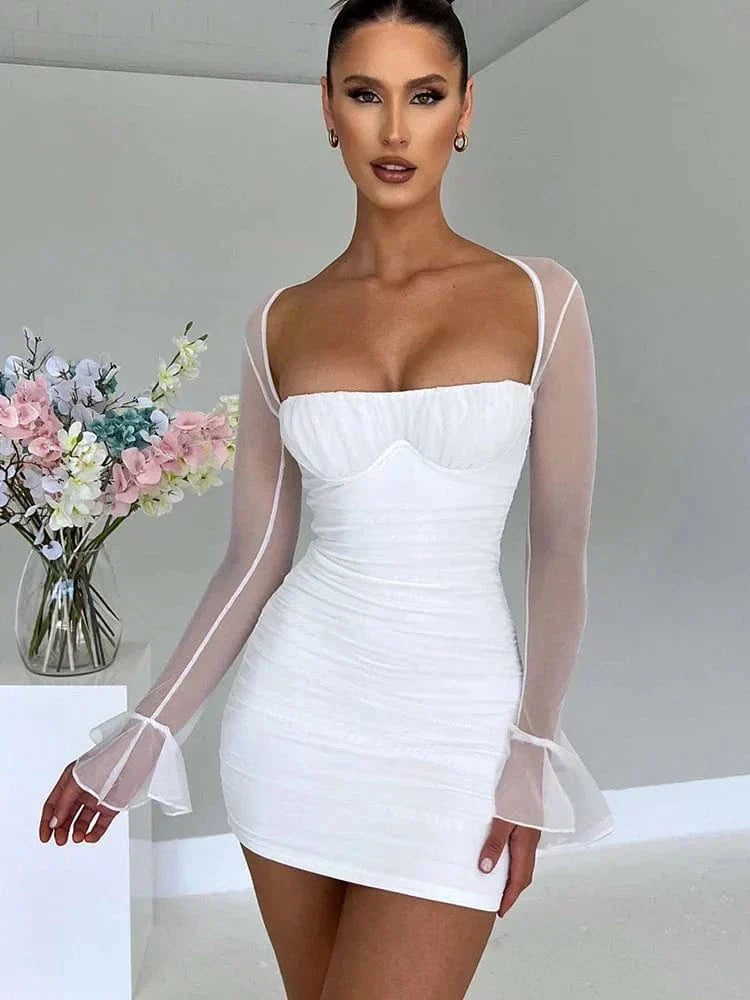Astraeon white bodycon mini dress with ruched design, fitted style, shown on a model in a close-up shot.
