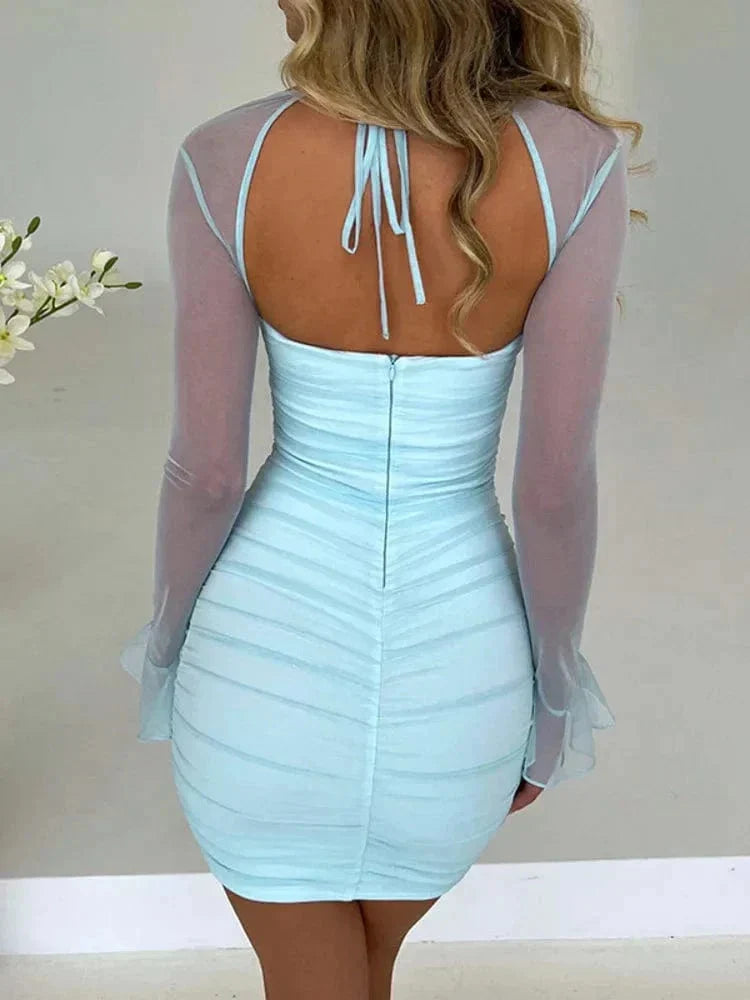 White Astraeon bodycon mini dress with ruched design, fitted style perfect for stylish occasions.