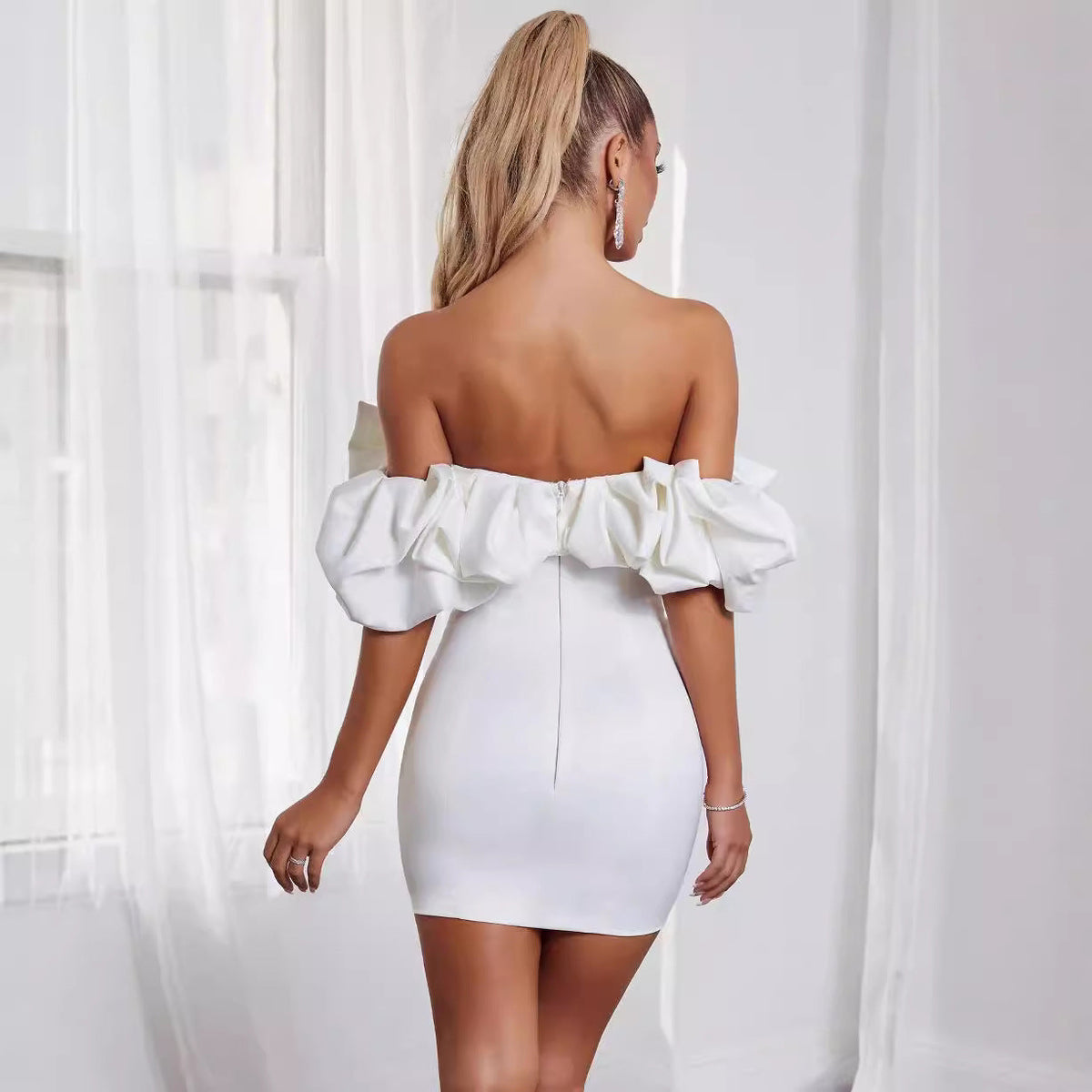 Black and white Aurora off-shoulder mini dress, featuring a stylish, fitted design perfect for casual or evening wear.