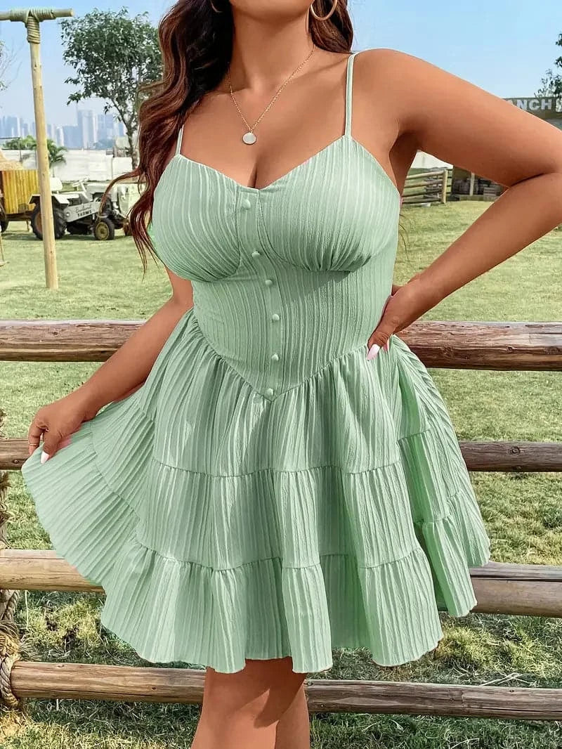 Light green spaghetti-strap mini dress with a button front and tiered skirt