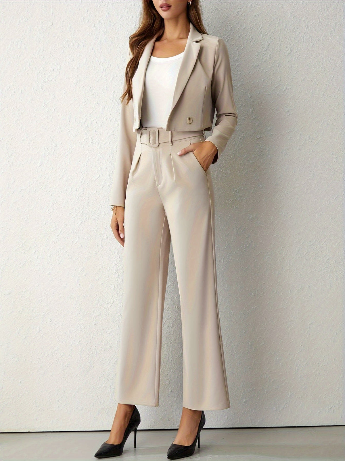 Beige two-piece suit with a cropped blazer and belted wide-leg trousers