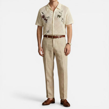 Man wearing a cream button-front crochet shirt, full front view