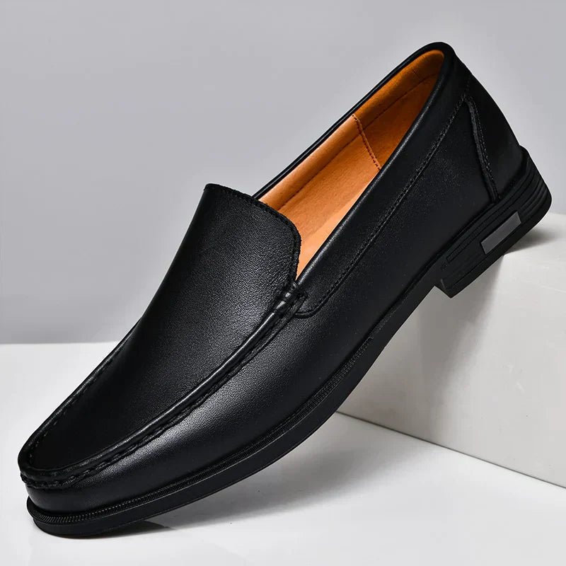 Black plain-front slip-on dress loafers with moc-toe stitching