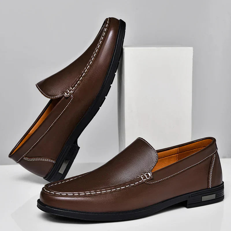 Brown plain-front slip-on dress loafers with moc-toe stitching