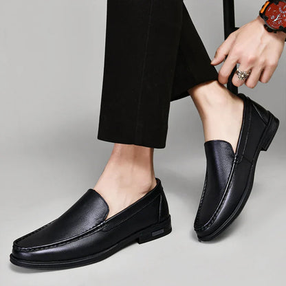 Black plain-front slip-on dress loafers with moc-toe stitching