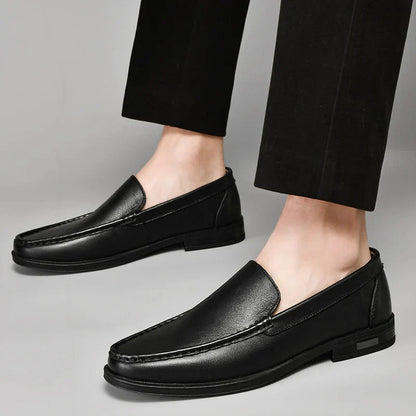 Black plain-front slip-on dress loafers with moc-toe stitching