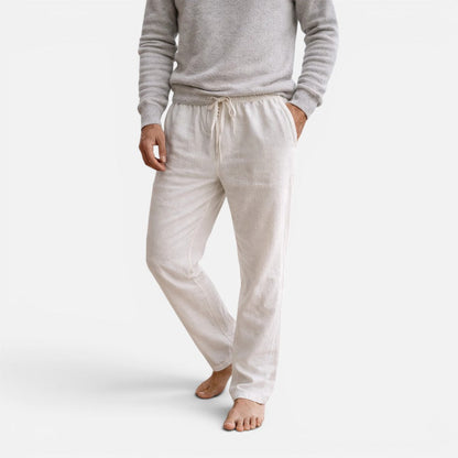 Man wearing off-white straight-leg drawstring trousers