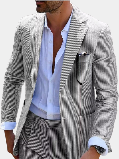 Man wearing a fine-striped suit jacket with matching trousers