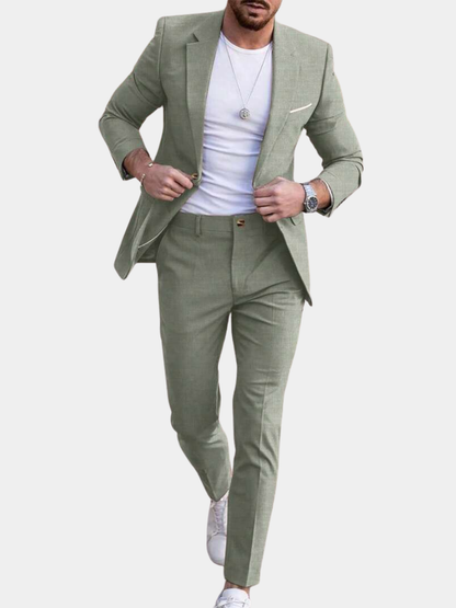 Man wearing an olive-green tailored suit with matching jacket and trousers, front view