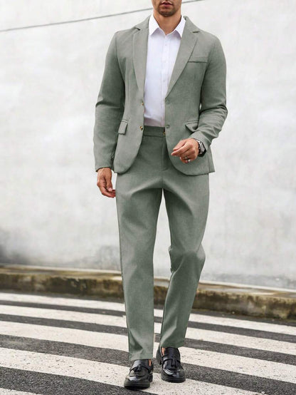 Man wearing an olive-green suit with a white shirt, front view