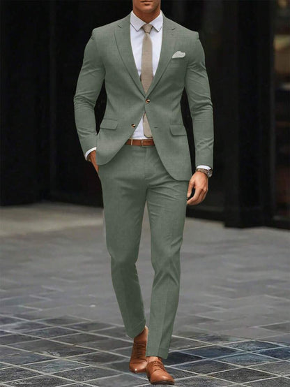 Man wearing an olive-green suit with a white shirt and tie, front view