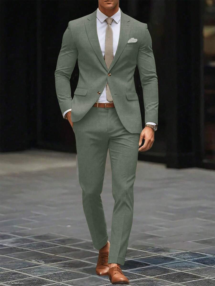 Man wearing an olive-green suit with a white shirt and tie, front view