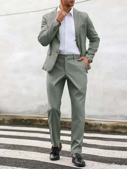 Man wearing an olive-green suit with a white shirt, front view