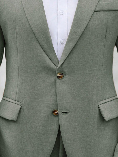 Close-up of an olive-green suit jacket showing notched lapels, buttons and flap pockets