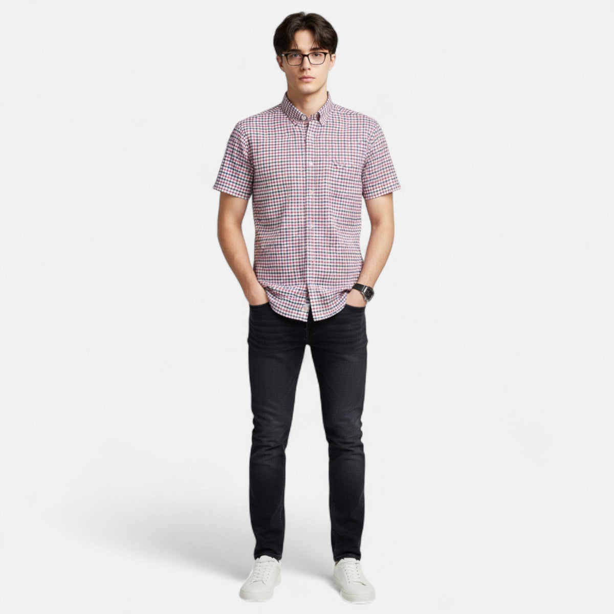 Man wearing a red and navy small-check short-sleeve button-down shirt, front view