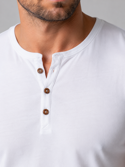 Close-up of the three-button neck on a white Henley T-shirt