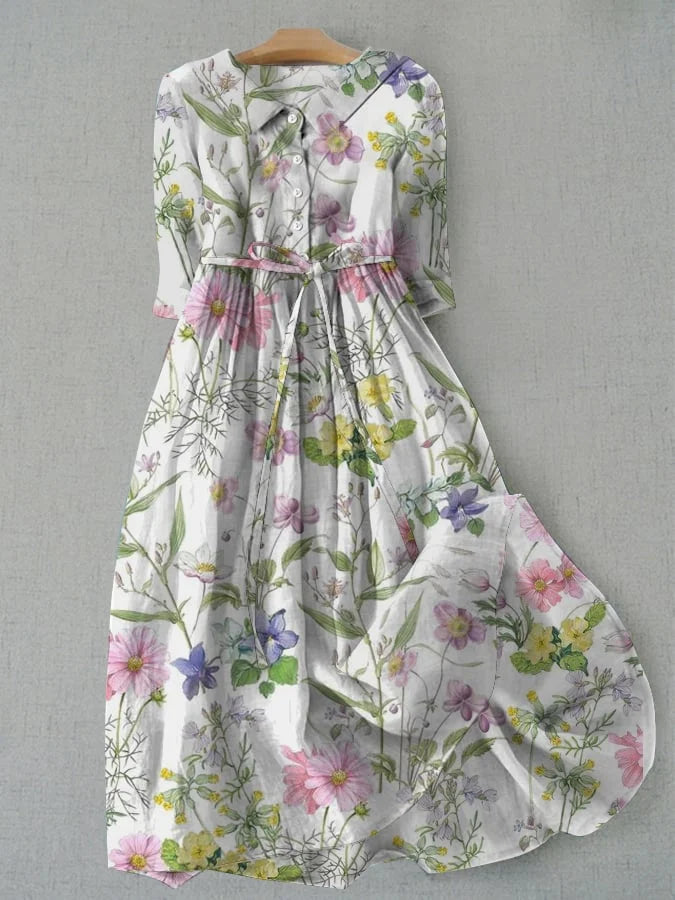 Floral button-front dress with a gathered waist, shown on a hanger