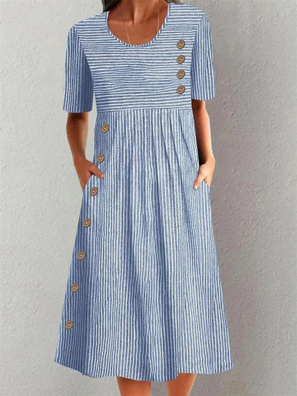 Blue striped dress with short sleeves, side pockets and decorative buttons