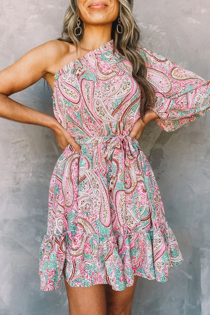Pink Astra one-shoulder mini dress, featuring stylish design and fitted silhouette on model.