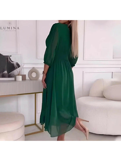Green Ana stylish wrap evening dress for women, perfect for wedding guests, featuring a flattering wrap design.