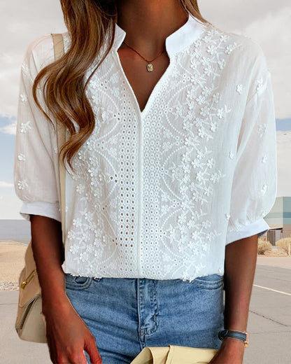 Elegant puff sleeve blouse with V-neck design, featuring a stylish and sophisticated look.