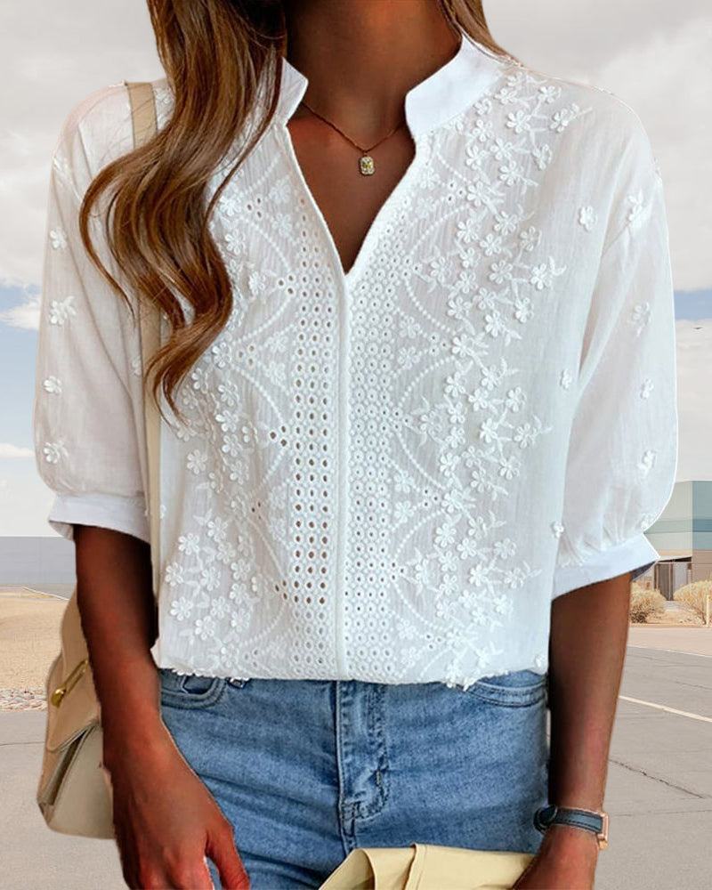 Elegant puff sleeve blouse with V-neck design, featuring a stylish and sophisticated look.