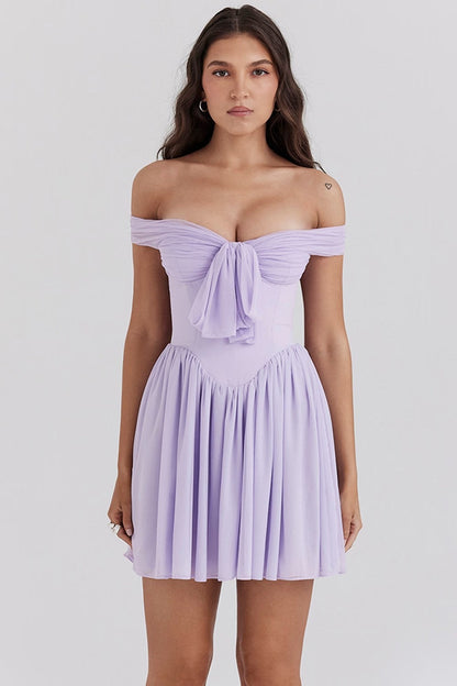 Lavender purple off-shoulder mini dress with bow front, featuring a stylish and feminine design.