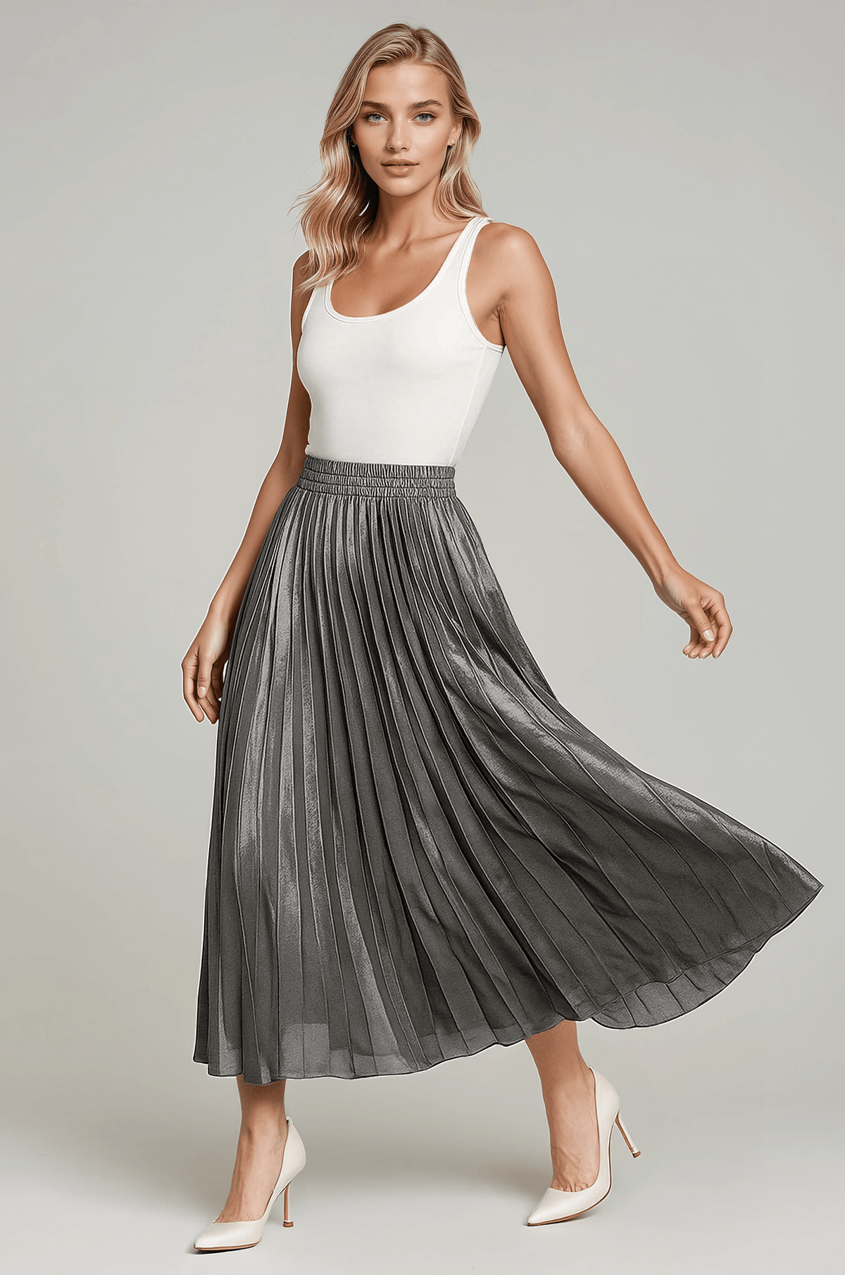 Grey pleated skirt flaring to one side, showing the high gathered waistband
