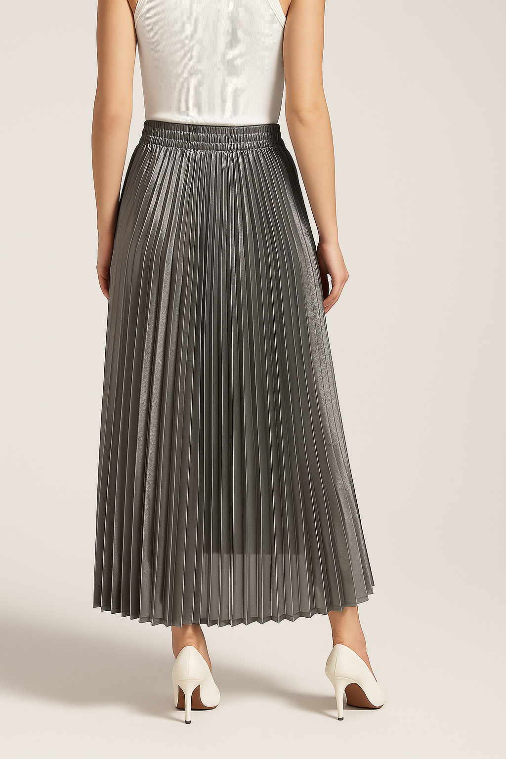 Back view of a grey pleated skirt with a high gathered waistband and softly flared hem