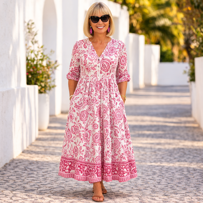 Woman wearing the pink floral V-neck maxi dress, front view