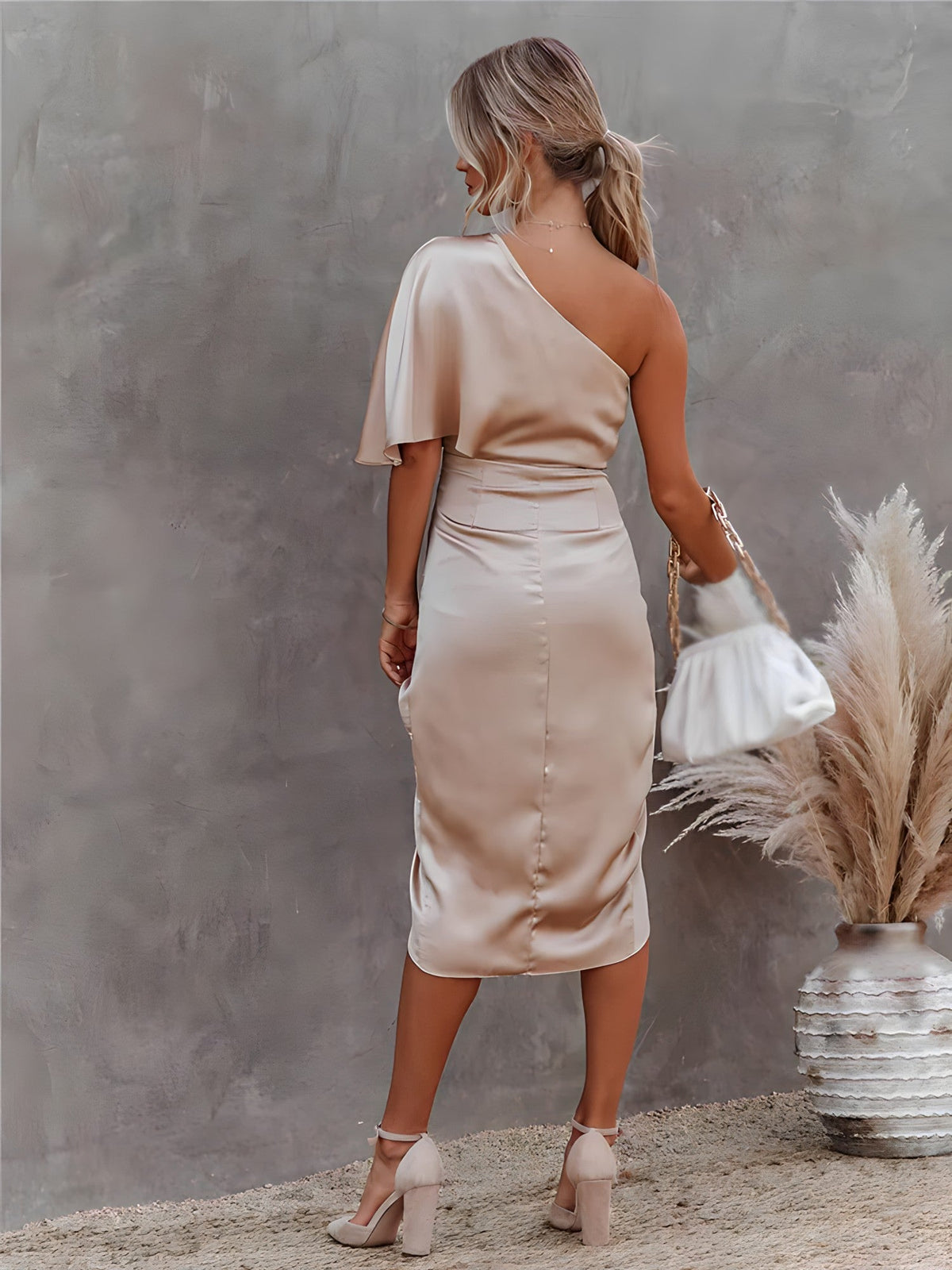 Women's one-shoulder dress with a draped sleeve